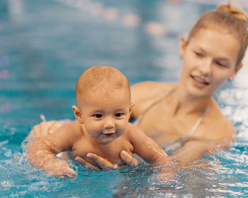 mother-and-little-son-having-fun-in-a-swimming-poo-2021-09-01-01-18-21-utc